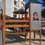 Structure de aire de jeux Citadel castle with slide en zone urbaine