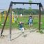 Double Safety Seat double swing avec deux enfants qui jouent dans un parc