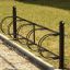Bike Stand - support à vélos en métal noir avec quatre supports circulaires.