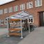 Bike Parking II abri extérieur pour vélos avec structure en métal et détails en bois