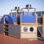 Structure de aire de jeux Steamboat ship with slide au design bleu et bois sur un sol de sécurité en caoutchouc