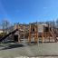 Structure de jeu extérieure Challenger Nature II avec un toboggan dans un parc.