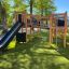 Équipement de jeu extérieur Challenger Nature II avec un toboggan et une structure d’escalade.