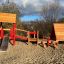 Ensemble de jeux Lasse's House avec un toboggan, un pont en bois et une structure d'escalade.