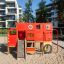 Structure d’escalade pour aire de jeux Big Truck single slide en rouge et jaune.