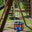 Double Swing équipement de jeu avec sièges bleus et rouges