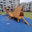 Galapagos wooden playhouse with slide dans un quartier résidentiel moderne