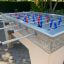 Football Table Game extérieur avec figurines rouges et bleues.
