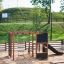 Structure de aire de jeux extérieure nommée Climbing Kiosk Nature dans un parc.