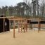 Motor Function Center Nature, wooden playhouse dans un parc.