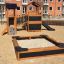 Sandbox Nature structure de jeu en bois avec toboggan et pont dans une zone urbaine.