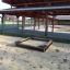 Sandbox Nature sous un espace extérieur couvert.