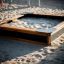 Bois Sandbox Nature dans une aire de jeux remplie de sable