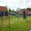 Structure d’escalade et balançoires Double Somersault dans une aire de jeux