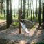 Équipement de aire de jeux extérieur 'Kilimanjaro steel structure' dans un cadre forestier.