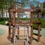 Sherwood wooden playhouse avec structure d'escalade dans un parc.