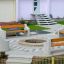 Banc circulaire extérieur Dona autour d'un foyer central dans un jardin moderne