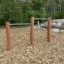 Double Somersault Nature - barres de gymnastique extérieures en bois et métal, installées dans un espace de jeu naturel