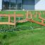 Parcours d'obstacles de terrain de jeu extérieur Gobi avec poutres d'équilibre en bois et filet d'escalade.