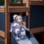 Enfants jouant sur Tower Nature wooden playhouse with slide.