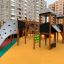 Château Mastodon avec toboggan dans une aire de jeux moderne