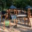 Structure de jeu château Mastodon avec toboggan dans un parc.