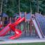 Aire de jeux château Mastodon avec toboggan.