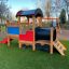 Locomotive with slide train playhouse sur une aire de jeux.