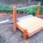 Structure de jeu en bois avec Hill Slide Wide h120 dans un parc.