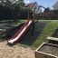 Extérieur Hill Slide SL150 dans une aire de jeux.