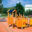Rubik playhouse with slide sur une aire de jeux orange.