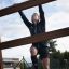 Une personne grimpe sur Step And Climb wooden ladder