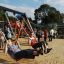 Des enfants jouent sur Double Swing with Tower playhouse with slide.