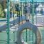 Équipement de terrain de jeu Sirius steel structure avec filet d’escalade et balançoire circulaire