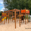 Space Station castle with slide sur une aire de jeux sablonneuse