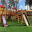 Space Station castle with slide dans un cadre d’aire de jeux