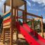 Logo Tower with Climbing Net playhouse with slide dans l'aire de jeux