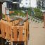 Smart Modern Nature wooden playhouse with slide dans une aire de jeux
