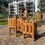 Smart Modern Nature wooden playhouse with slide devant des immeubles résidentiels