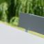 Table et banc gris de la gamme de produits Table & Bench 6 Seats HPL dans un parc.