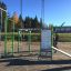 Équipement de fitness extérieur Information Board NAF avec instructions d'entraînement dans un cadre de parc.