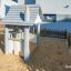 Maison de jeu pour enfants Nill's Playhouse dans un bac à sable.