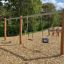 Double Robinia Swing Nature 1 + 2 (BNS 120 cm) (multiple swing) dans une aire de jeux avec trois s différents