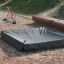 Sandbox cover 2m x 2m sur une aire de jeux.